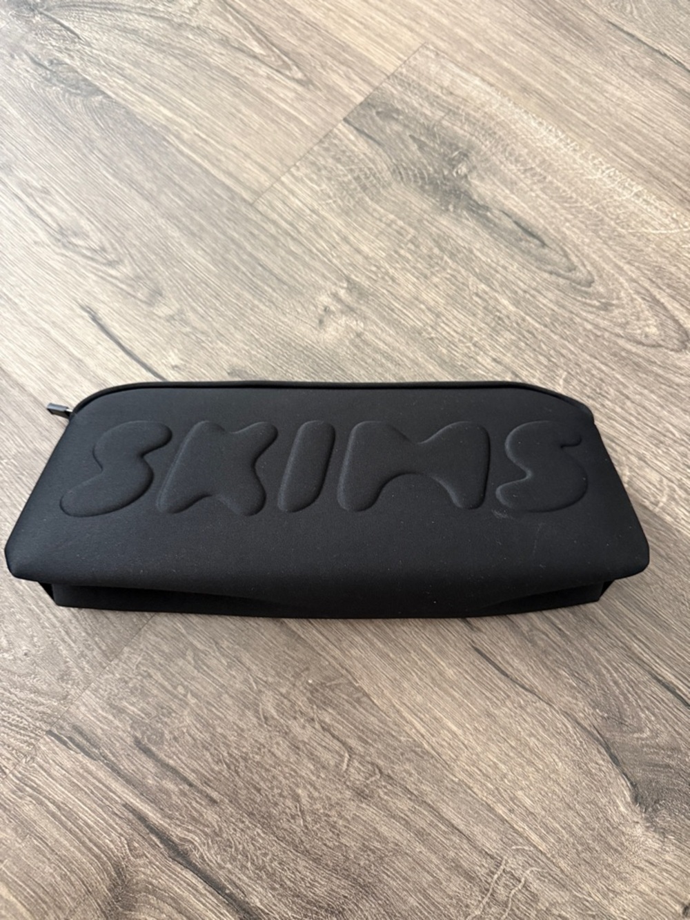 SKIMS Black Embossed Logo Zip Pouch- neoprene